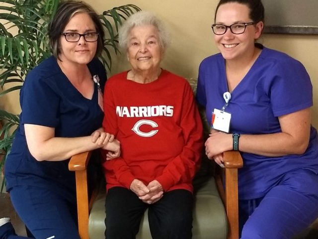 Acts of Caring: Mountain View nurses help a grandmother listen to an important ballgame